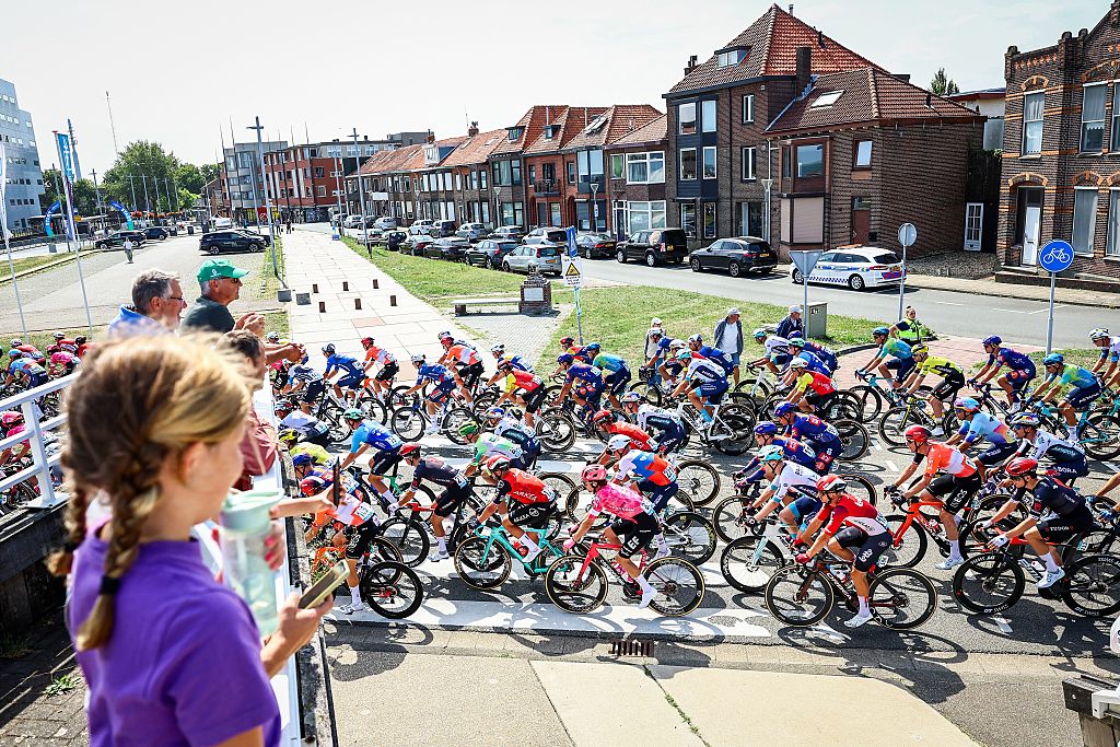 The pack of riders pictured in action during the first stage of the 'Renewi Tour' multi-stage cycling race, from Terneuzen to Breskens, The Netherlands (182,7 km) on Wednesday 20 August 2025. The five-day race takes place in Belgium and the Netherlands. BELGA PHOTO DAVID PINTENS (Photo by DAVID PINTENS / BELGA MAG / Belga via AFP) (Photo by DAVID PINTENS/BELGA MAG/AFP via Getty Images)